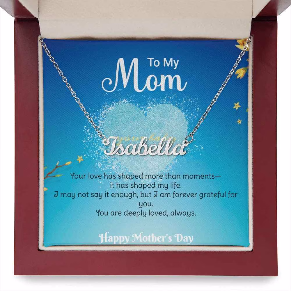 Stylish mum wearing custom name pendant necklace, sentimental Mother’s Day jewelry gift.